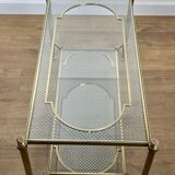 Rare bronze, brass, and steel mesh coffee table with a double glass top resting on a brass mesh. French work by Jansen