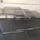 Nesting tables in chromed metal with smoked glass tops from the 1970s