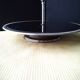 Cheese tray on shower stand in stainless steel and black tinted glass