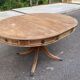 Round extendable dining table Regency central leg stripped mahogany 1960