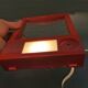 Red danish make up mirror with light and power plug from the 1970