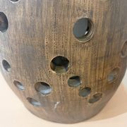 Terracotta lamp with cut-outs, circa 1970.