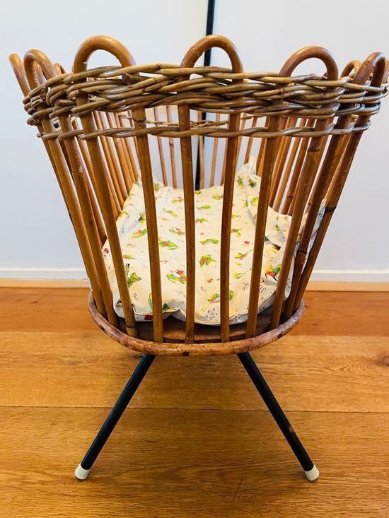 Vintage rattan doll cradle