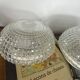 Large pair of round wall sconces ceiling lights in transparent glass.
