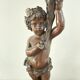 Candelabra with cherub in patinated bronze