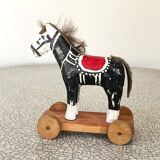 Old wooden pull-along toy, horse.