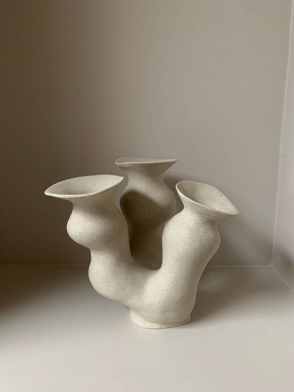 Organic-shaped vase in pyritic stoneware.