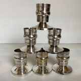 Six silver-plated metal candlesticks with punches
