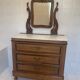 Wooden and marble chest of drawers with mirror