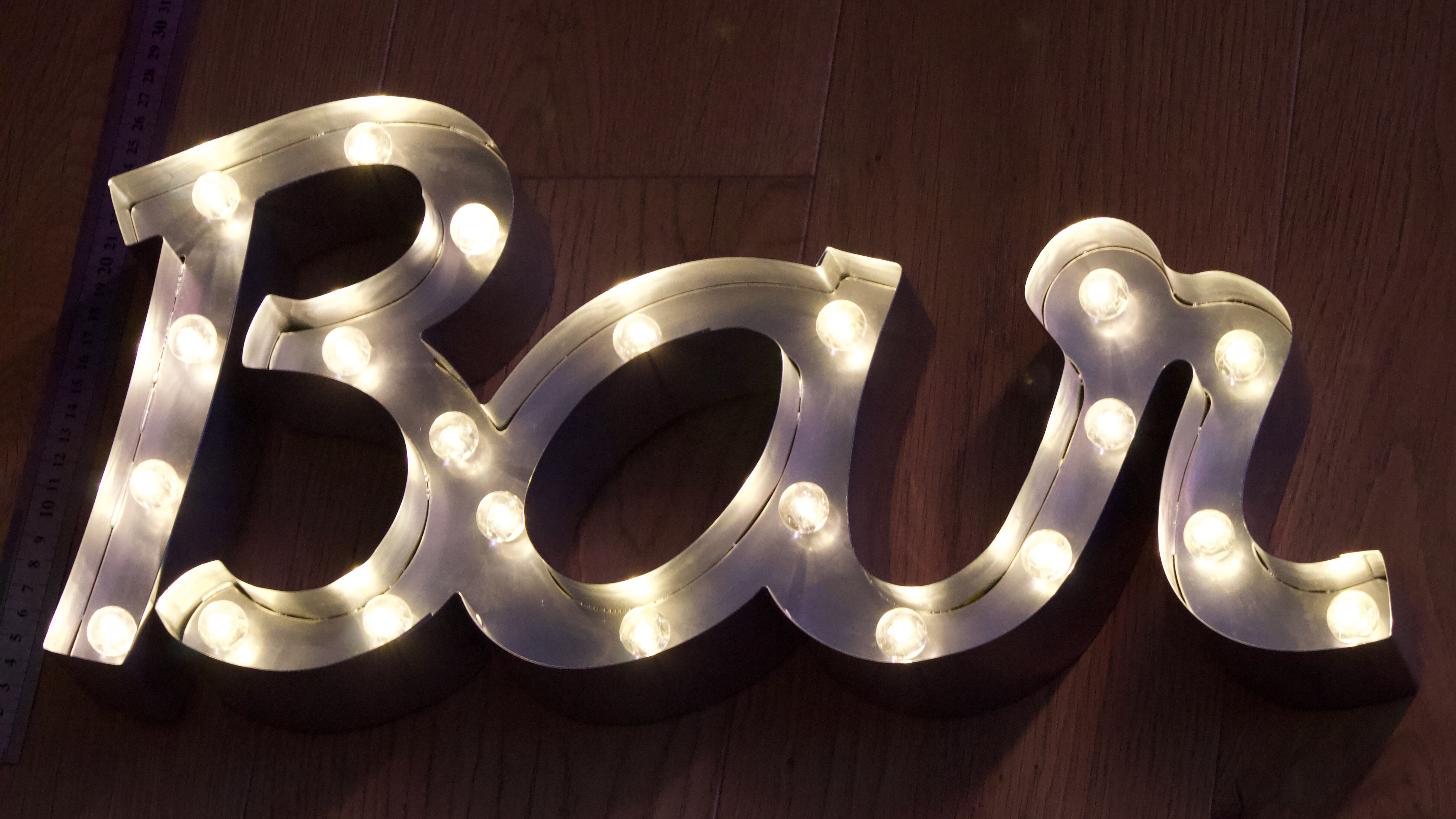 Ancient Light Sign in aluminium lettering forming the word "BAR"