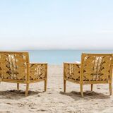 Pair of rattan armchairs with fan patterns