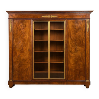 Important flamed mahogany library in Empire style from around 1900.