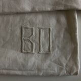 Pair of modernist linen pillowcases embroidered with comic strips