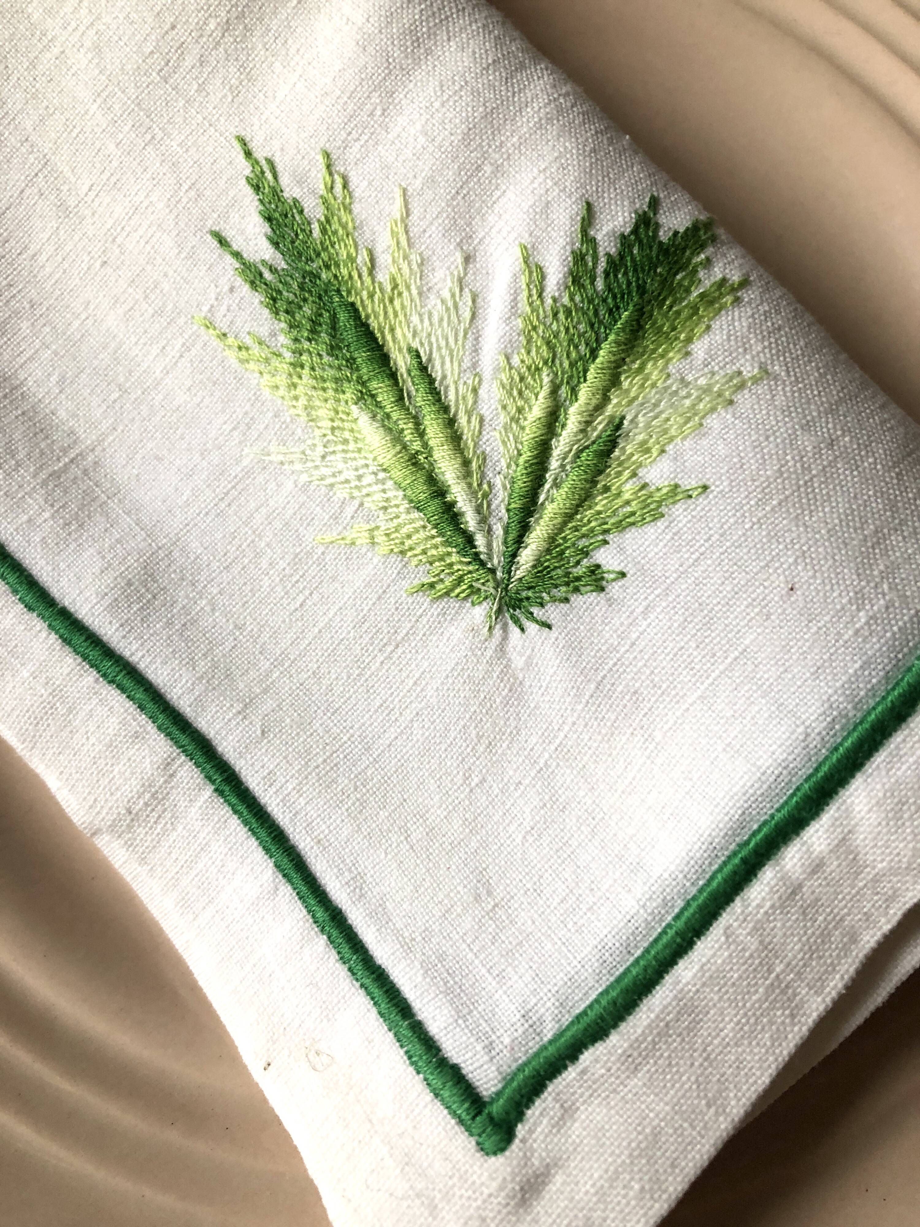 Series of four embroidered linen napkins