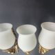 Three large vintage torch wall sconces.