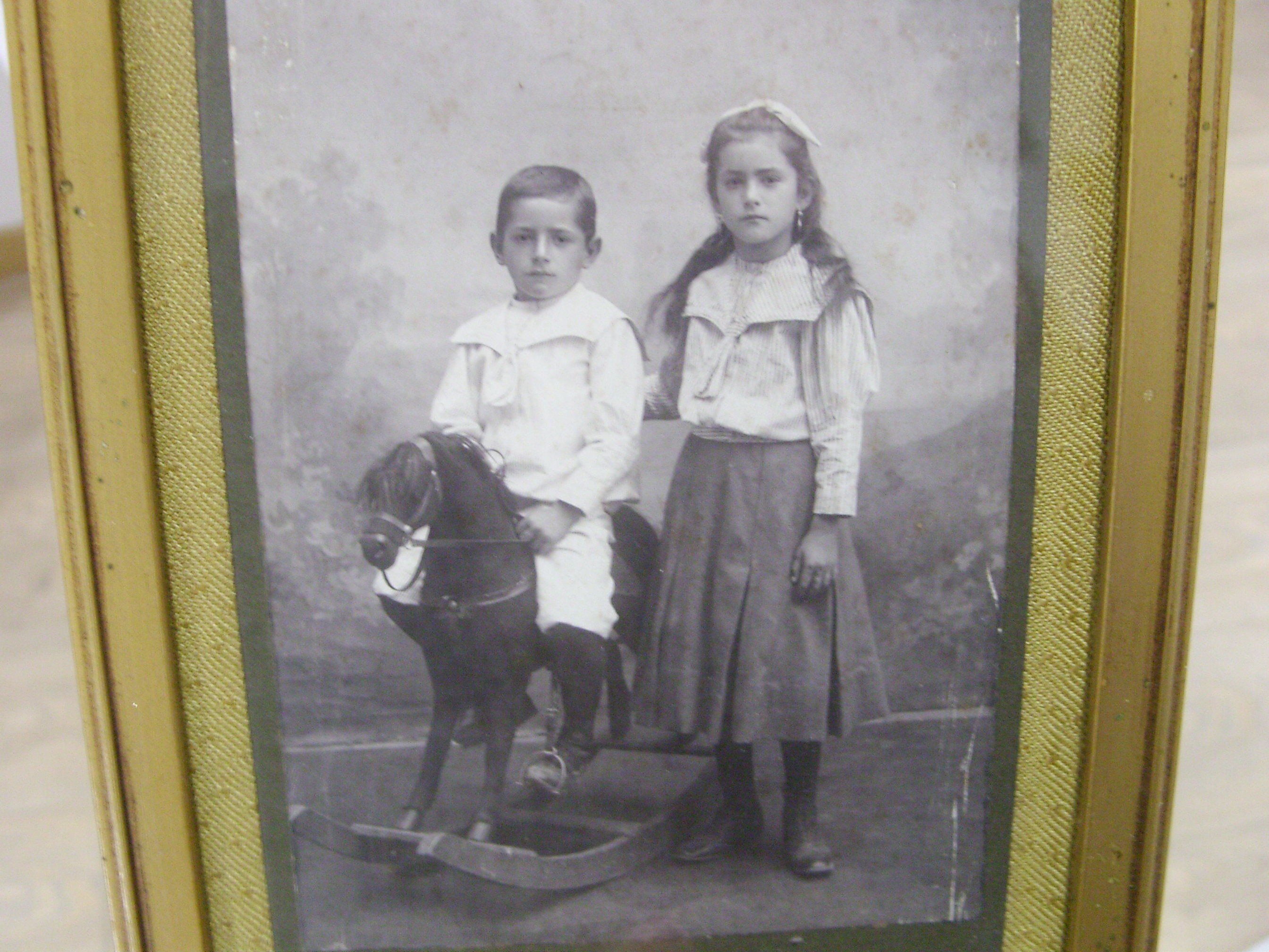Former Art Deco photo frame with children's photo and wooden horse