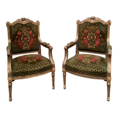 Paire de fauteuils en bois doré style Louis XVI