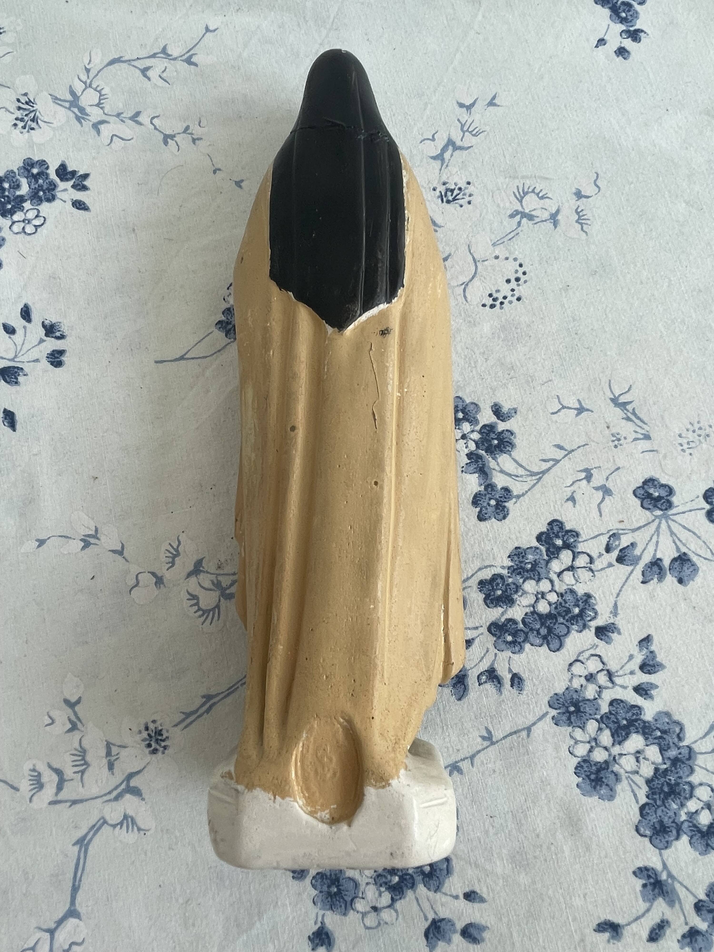 Antique statue of Saint Therese of Lisieux, religious plaster figurine