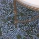 Round neoclassical coffee table with a marble top and golden metal base.