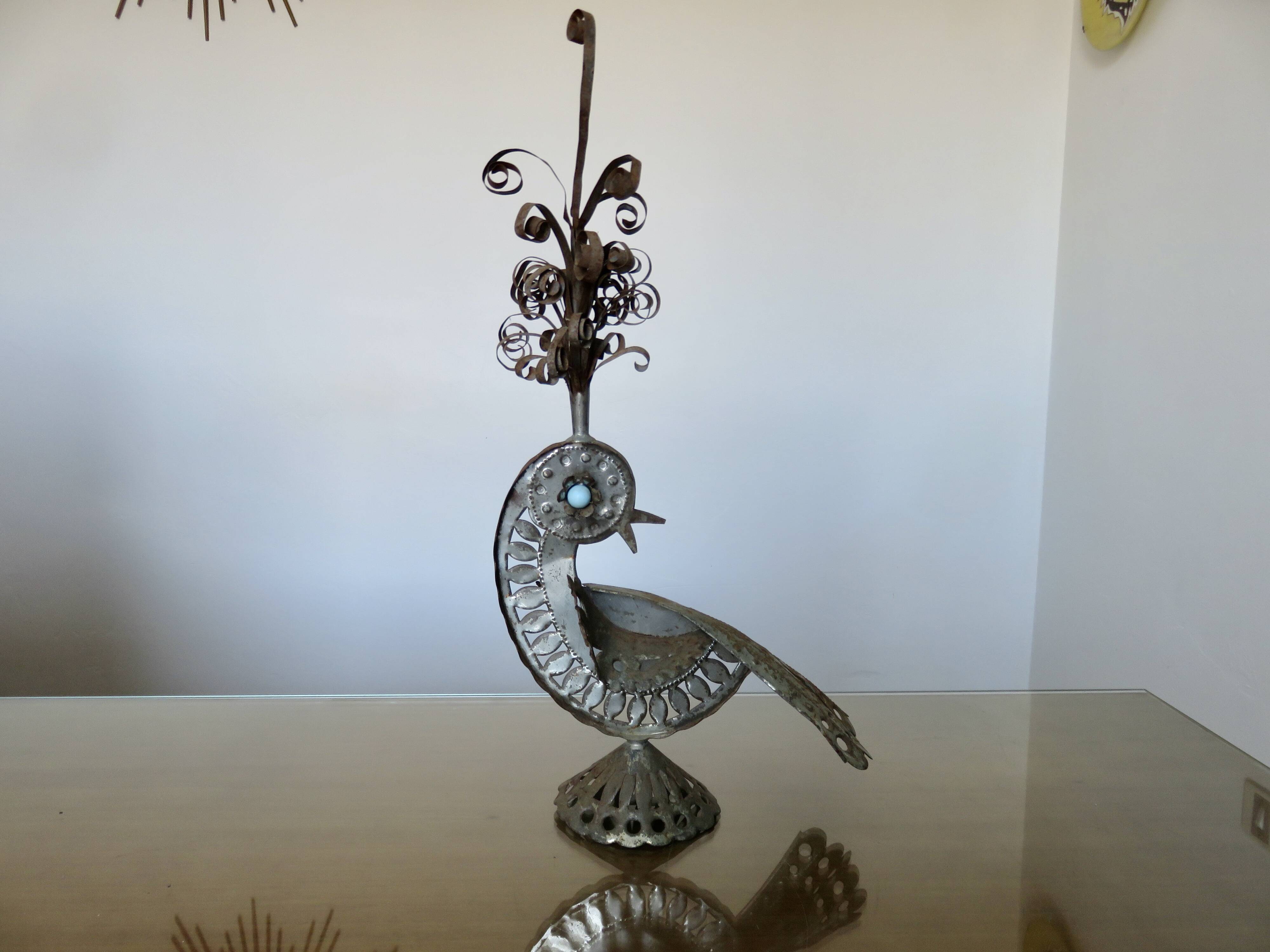 metal sculpture in sheet metal representing a peacock, work from the 1960s