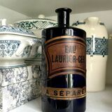 Flacon d'apothicaire eau laurier-cer. en verre bleu