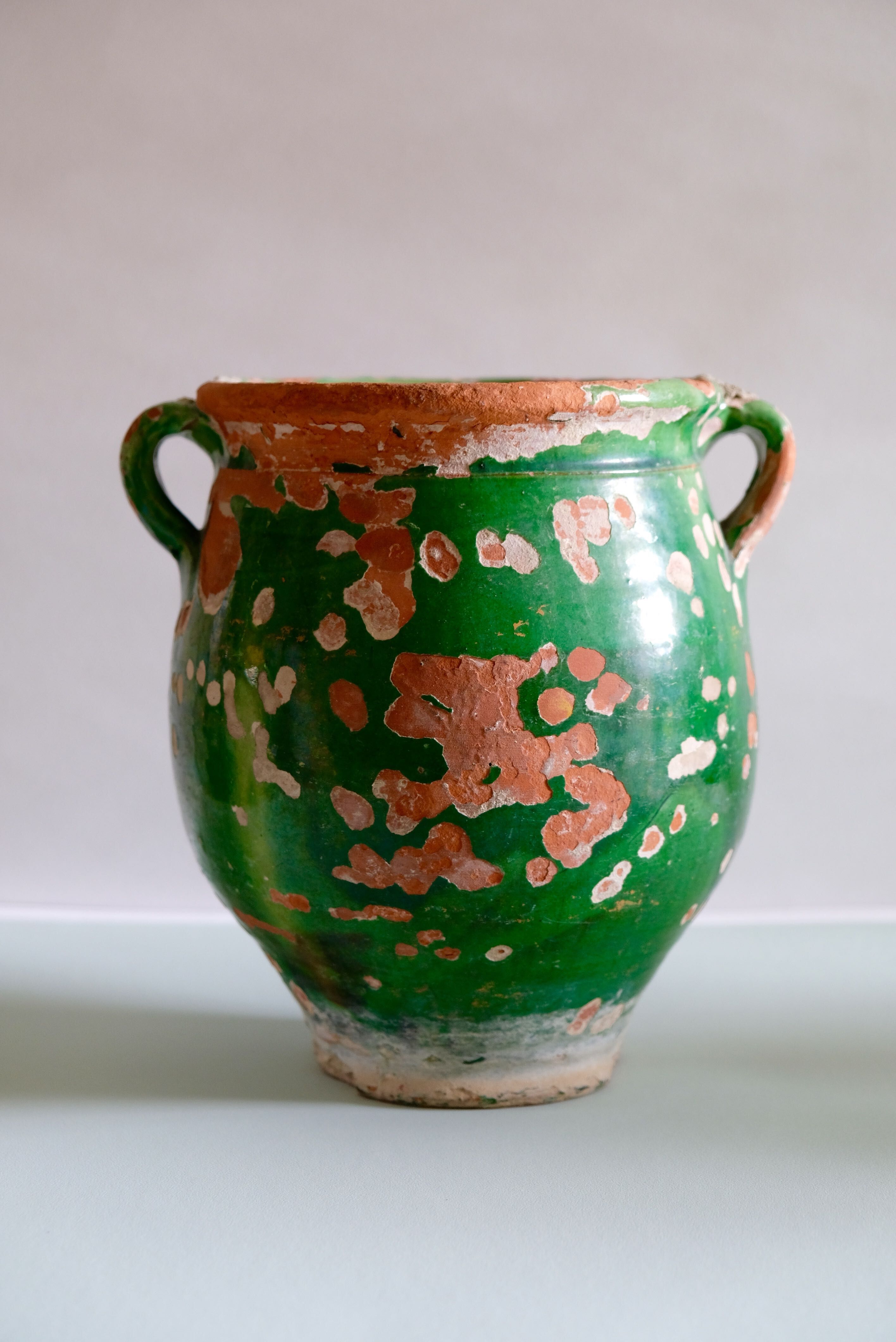 Ancient jar olive in provencal glazed terracotta, glazed green of the 19th century