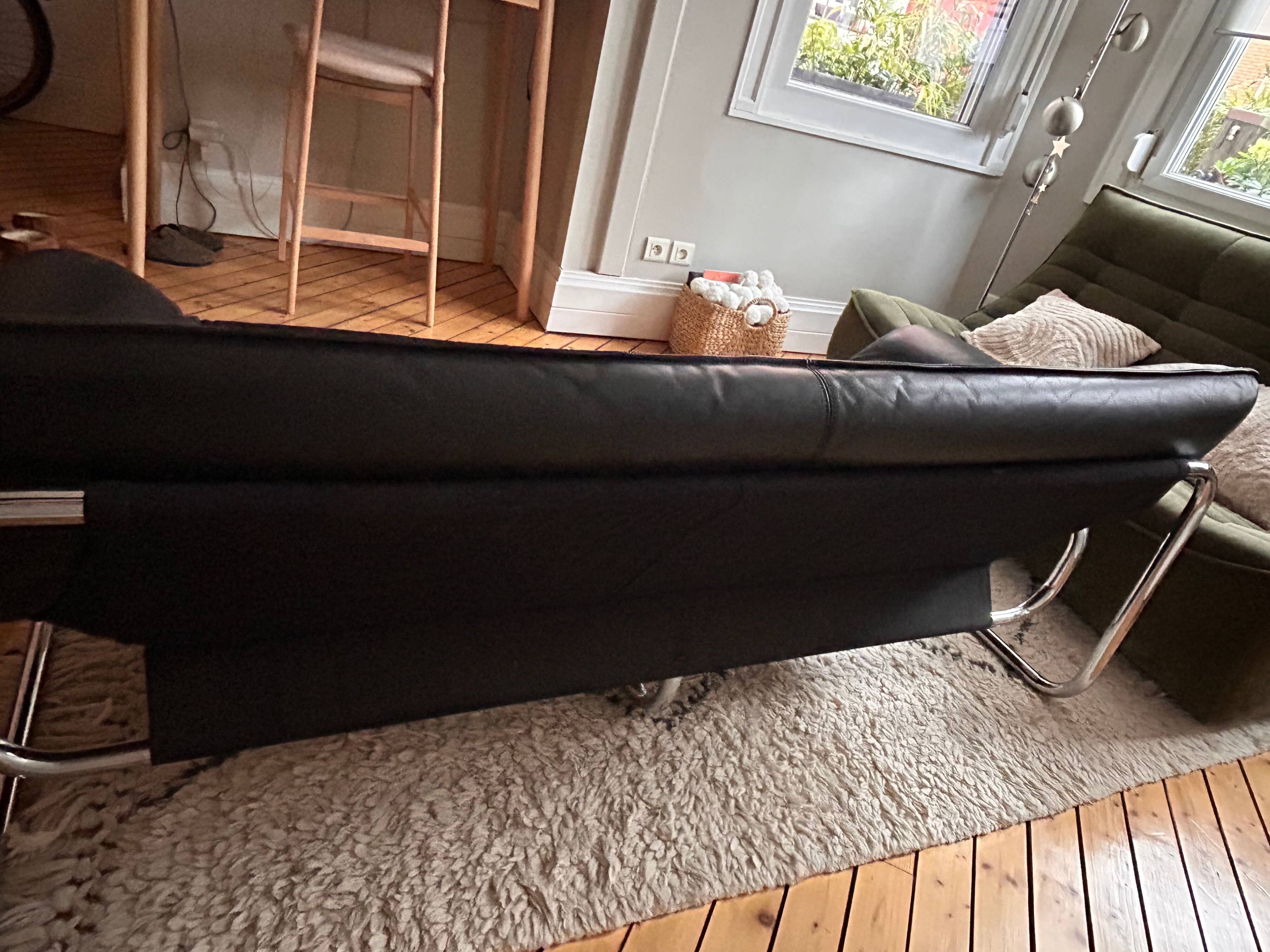 Black leather sofa designed by Johan Bertil Häggström