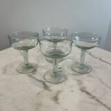 Set of four blown glass stemmed glasses.