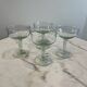 Set of four blown glass stemmed glasses.