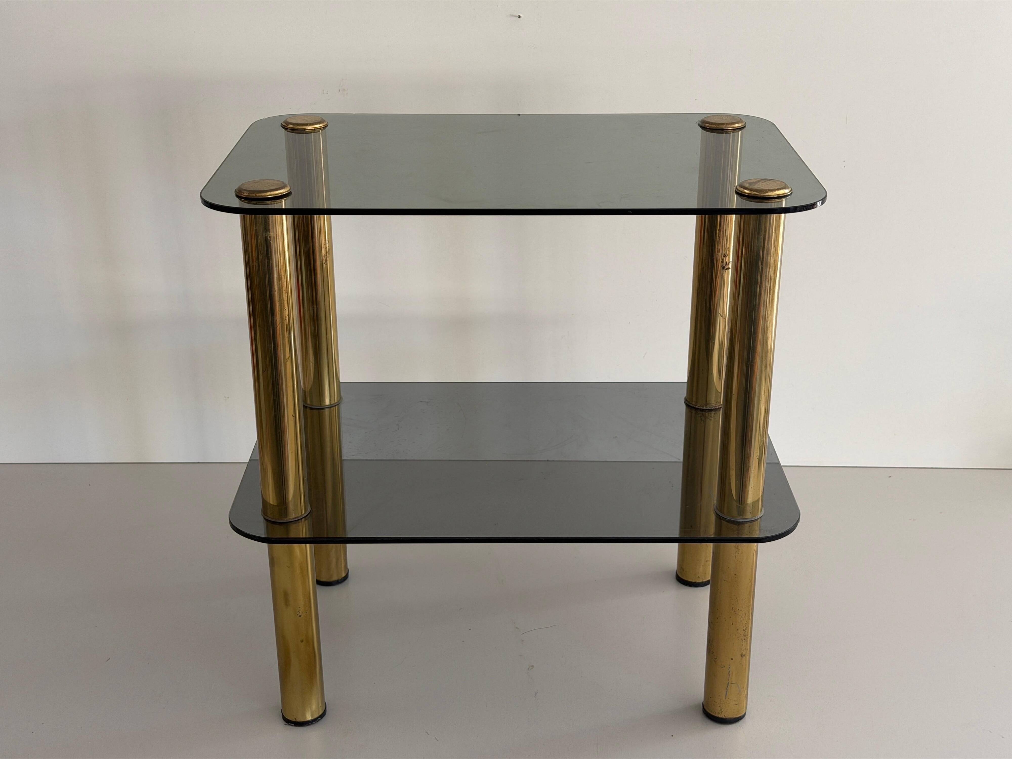 Side table in thick greenish glass with brass legs, Italy, 1960s.