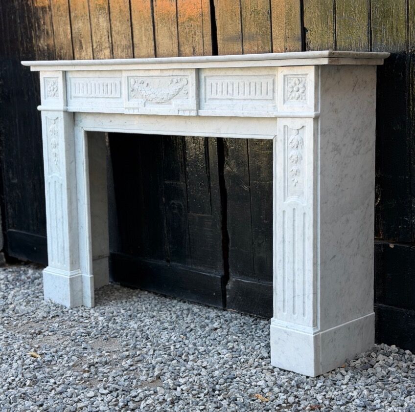 Louis XVI style fireplace in white Carrara marble, circa 1880.