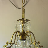 Old brass chandelier with glass stamps