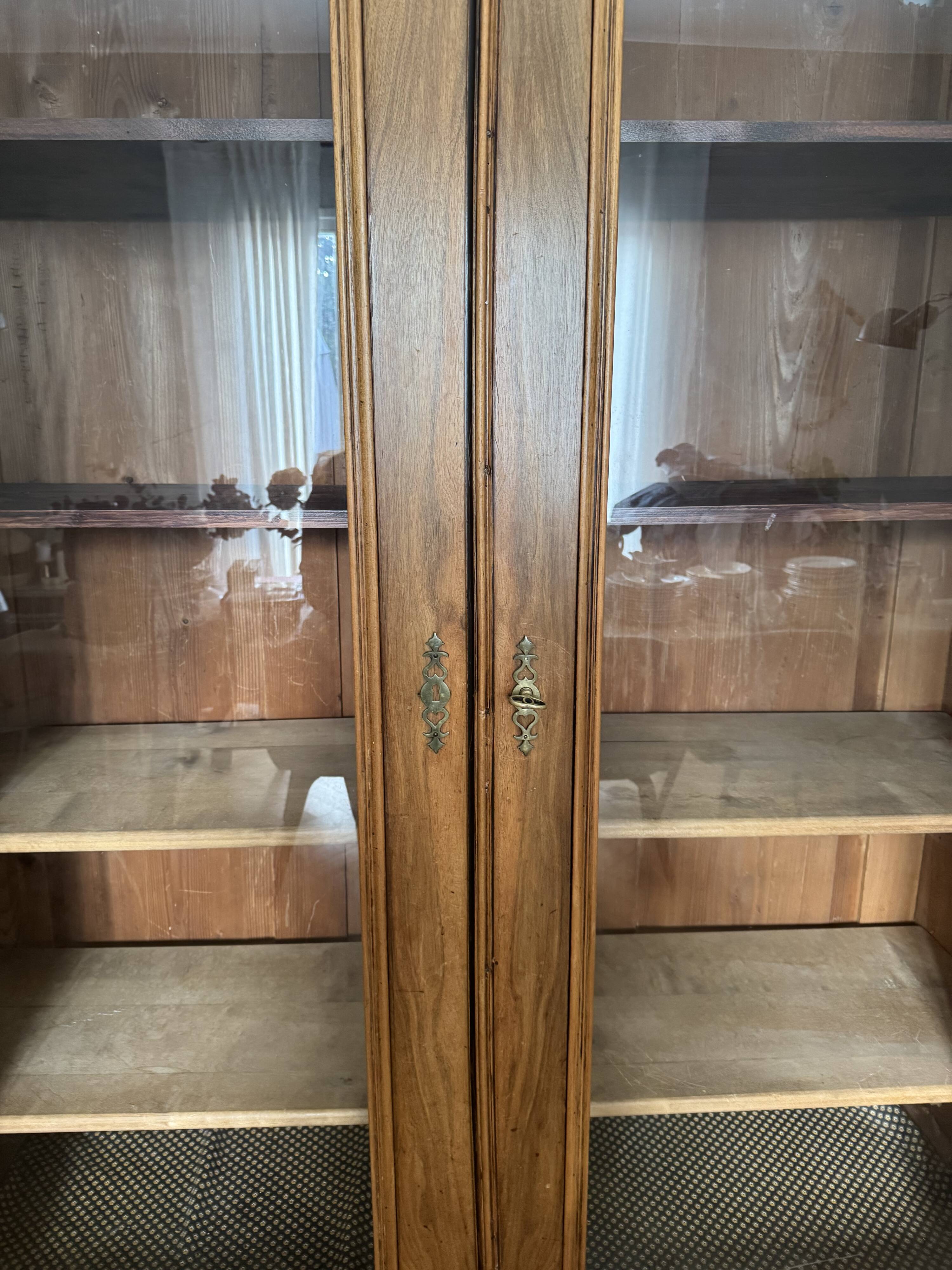 American walnut glass cabinet/bookcase