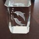 Glass dolphin paperweight