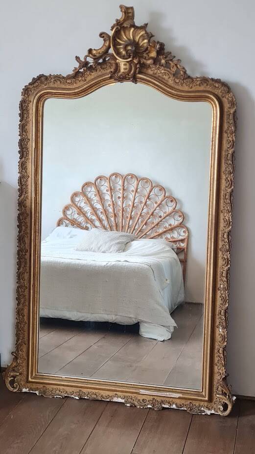 Antique Louis Philippe mirror with a pediment.