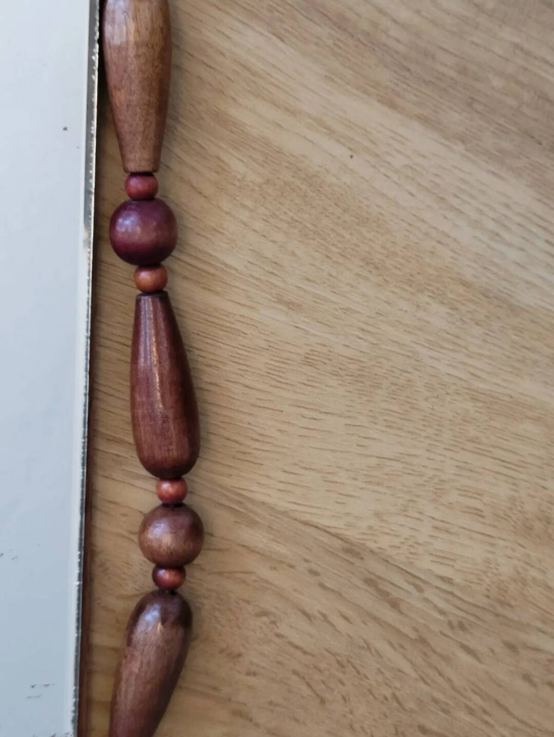 Miroir bohème vintage en perles de bois