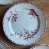 A series of eight flat plates in Terre de fer earthenware, Favori aux oiseaux model - pink tint