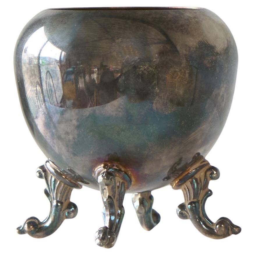 Neoclassical cup with a patinated and silvered copper base.