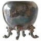 Neoclassical cup with a patinated and silvered copper base.