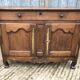 Antique Louis XV low chestnut sideboard with 2 doors and 1 drawer.
