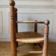 Straw and turned wood fireplace armchair in the style of Charles Dudouyt
