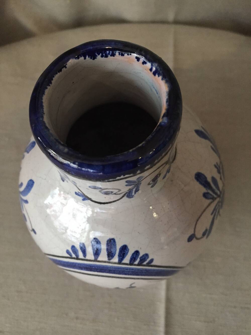 Small white decorative vase with blue floral decoration