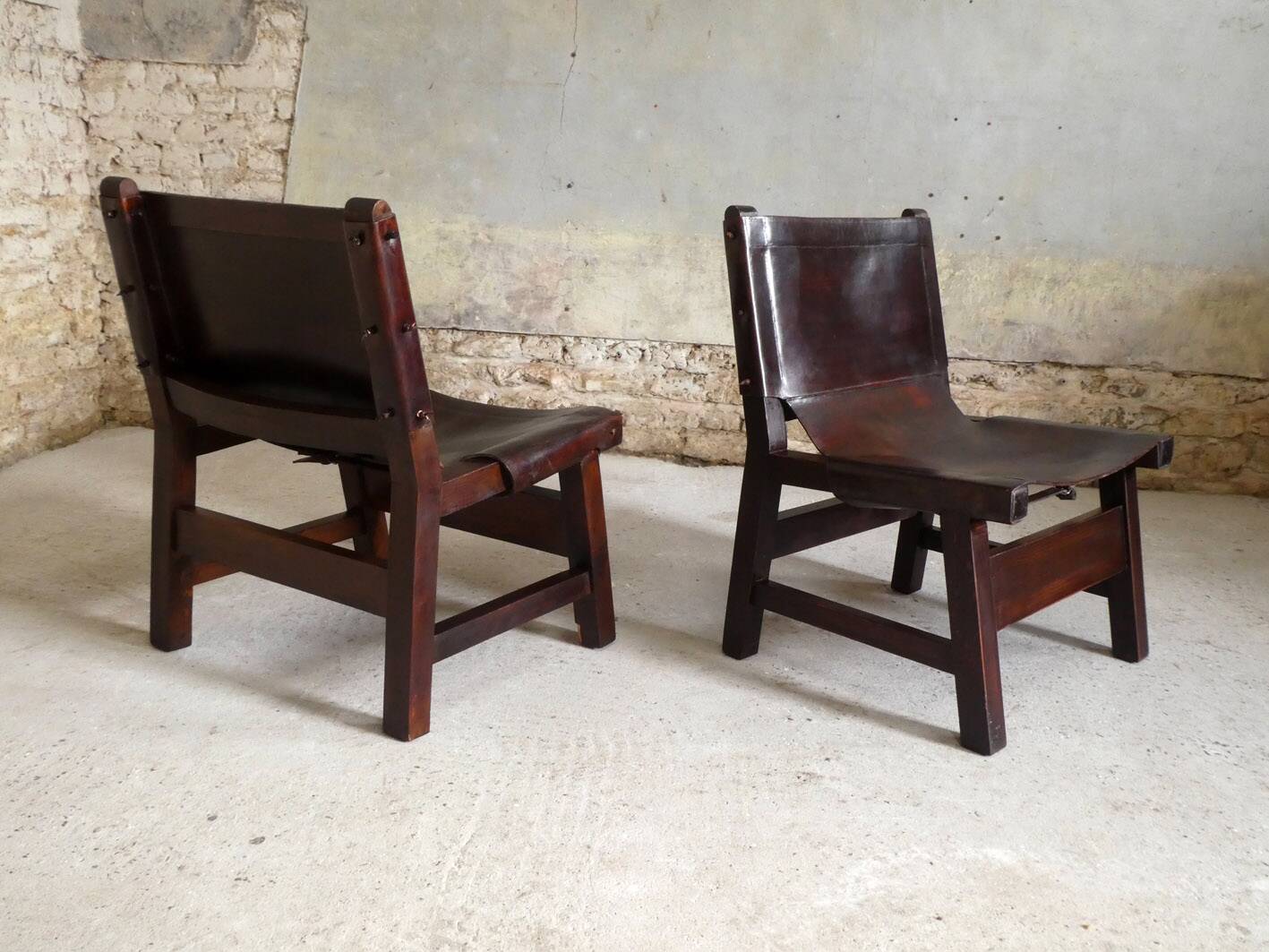 Pair of brutalist armchairs in wood and leather, 1970