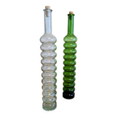 Pair of vintage ribbed blown glass bottles with cork stoppers.