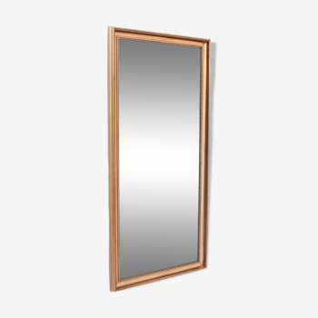 Mirror in a gold frame.