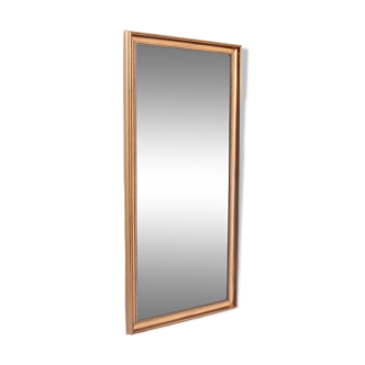Mirror in a gold frame.