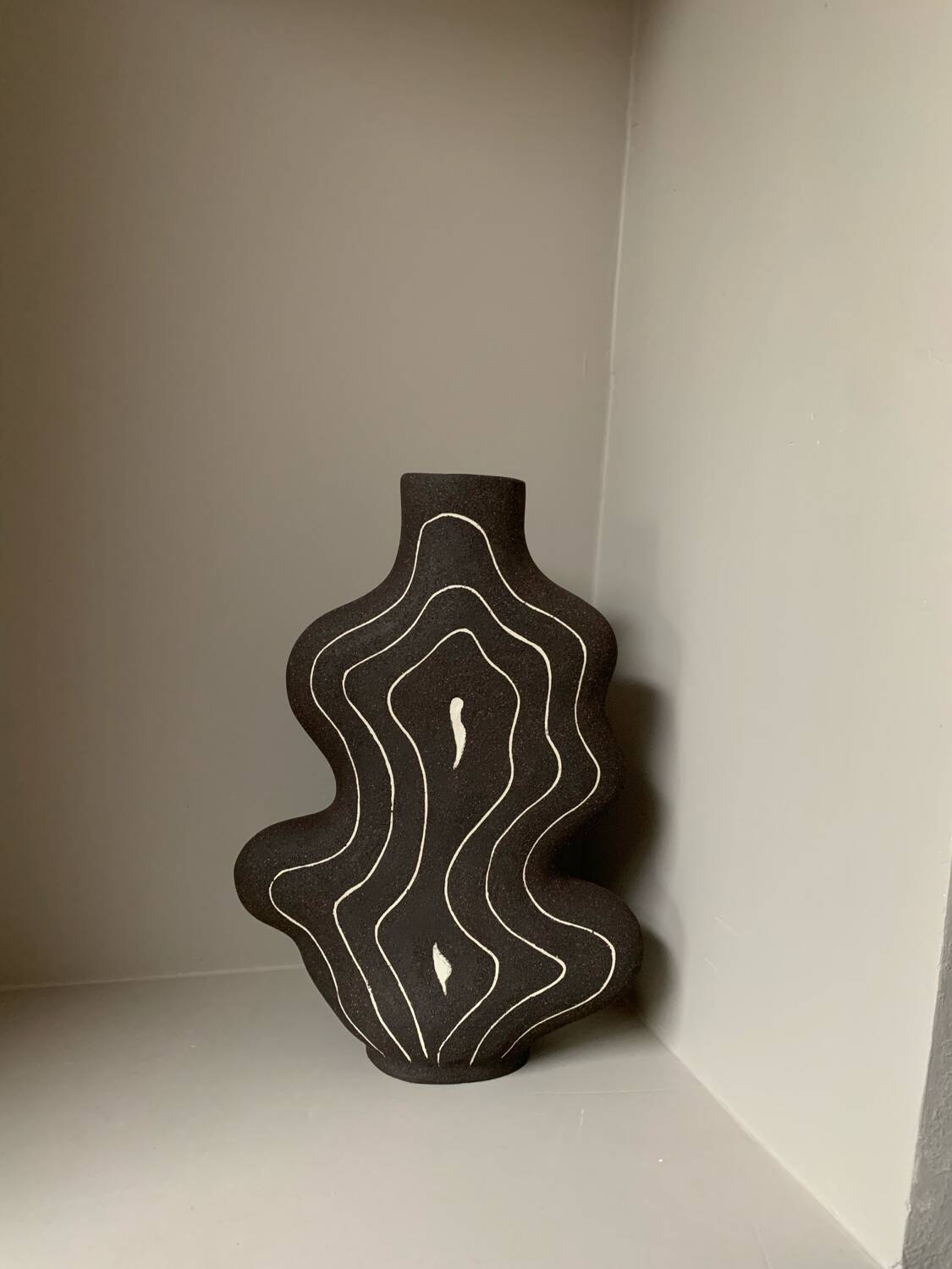Raw black stoneware vase