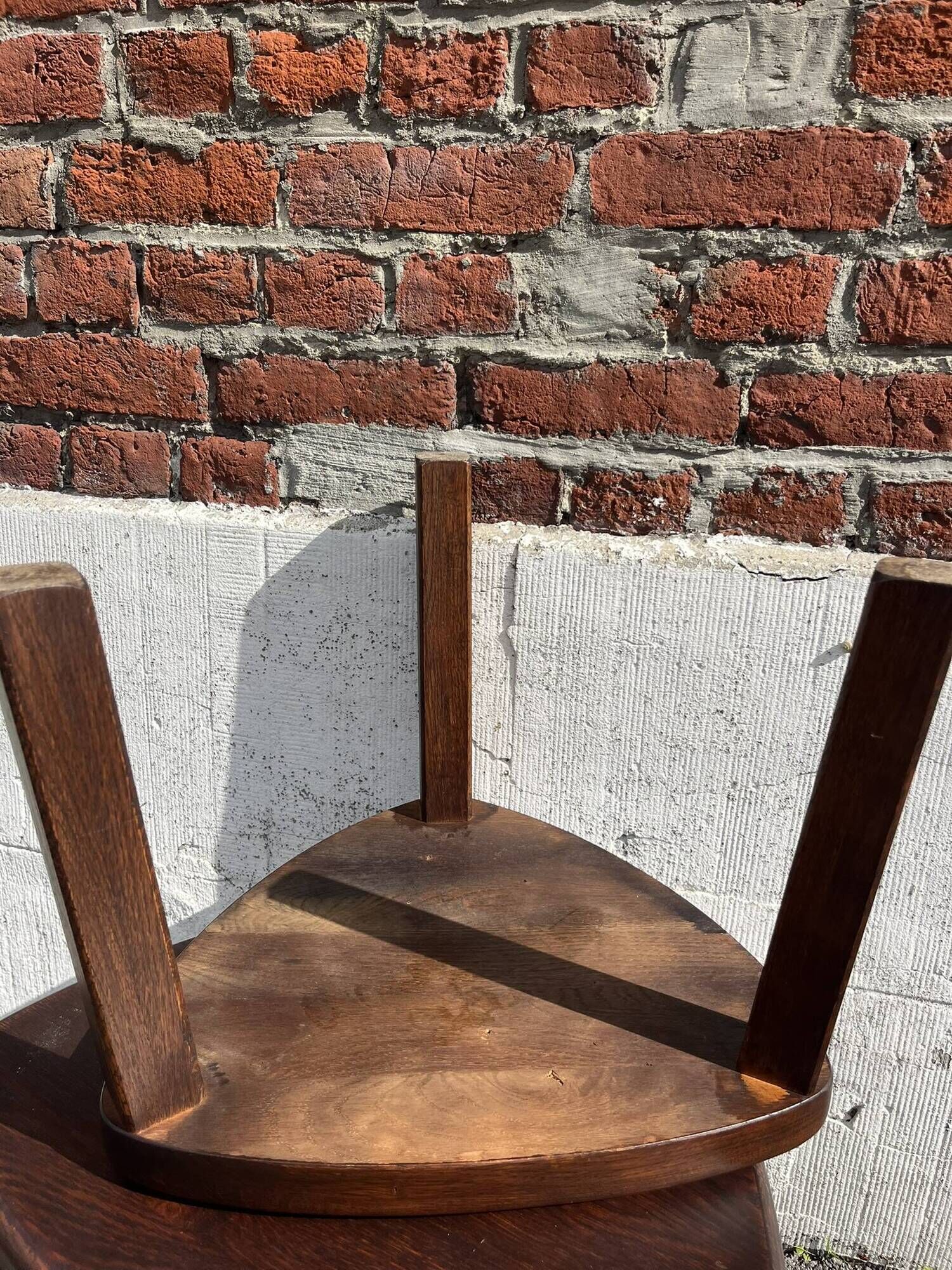 Nested tripod tables made of solid wood, in a modernist brutalist style.