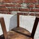 Nested tripod tables made of solid wood, in a modernist brutalist style.