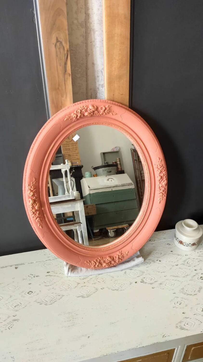 Oval terracotta mirror with pink shapes in resin